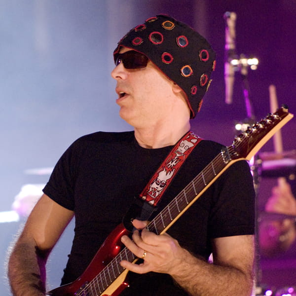 Joe Satriani live playing on stage